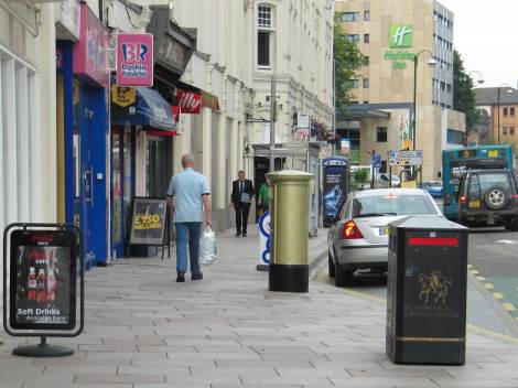 Golden Postbox opposite Cardiff Castle Clock Tower